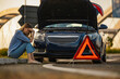 © ivanko80 - Woman stranded with car breakdown