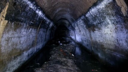Canvas Print - Underground urban sewer tunnel. Large sewage collector