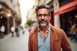 Portrait of handsome middle-aged man wearing eyeglasses in the city