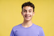 Closeup portrait of smiling confident boy with dental braces on teeth looking at camera