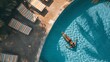 Aerial view of a woman relaxing next the swimming pool in a luxury resort Antioquia Colombia : Generative AI