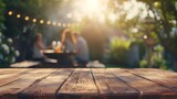 Fototapeta  - Empty wooden table and blurred view of people having barbecue with modern grill outdoors : Generative AI