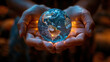 Hands cradling a glowing globe at night, symbolizing care for planet Earth.