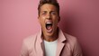 © nahij - Portrait of a young man screaming and screaming on a pink background