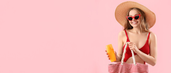 Poster - Beautiful young woman holding beach bag and sunscreen cream on pink background with space for text