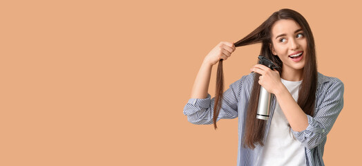 Poster - Beautiful young woman using hair spray on beige background with space for text