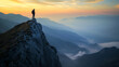© Taskmanager - A hiker with a backpack standing on a ridge, overlooking a dramatic mountain landscape at sunset.