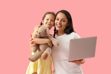 Poster - Working mother and her little daughter with toy on pink background