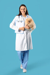 Sticker - Female veterinarian with cute Pomeranian dog and clipboard on blue background