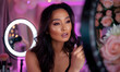 © Ilham - Beauty vlogger. young woman recording a makeup tutorial