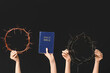 Female hands with Holy Bible and crowns of thorns on dark background. Good Friday concept