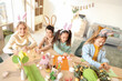 © Pixel-Shot - Little children in bunny ears making Easter crafts at table