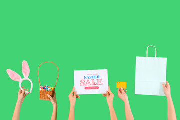 Poster - Women with shopping bag, credit card and decor on green background. Easter Sale