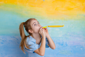 Wall Mural - Portrait of funny girl with festive decor on yellow background. Celebration and party. Fool's day concept, birthday