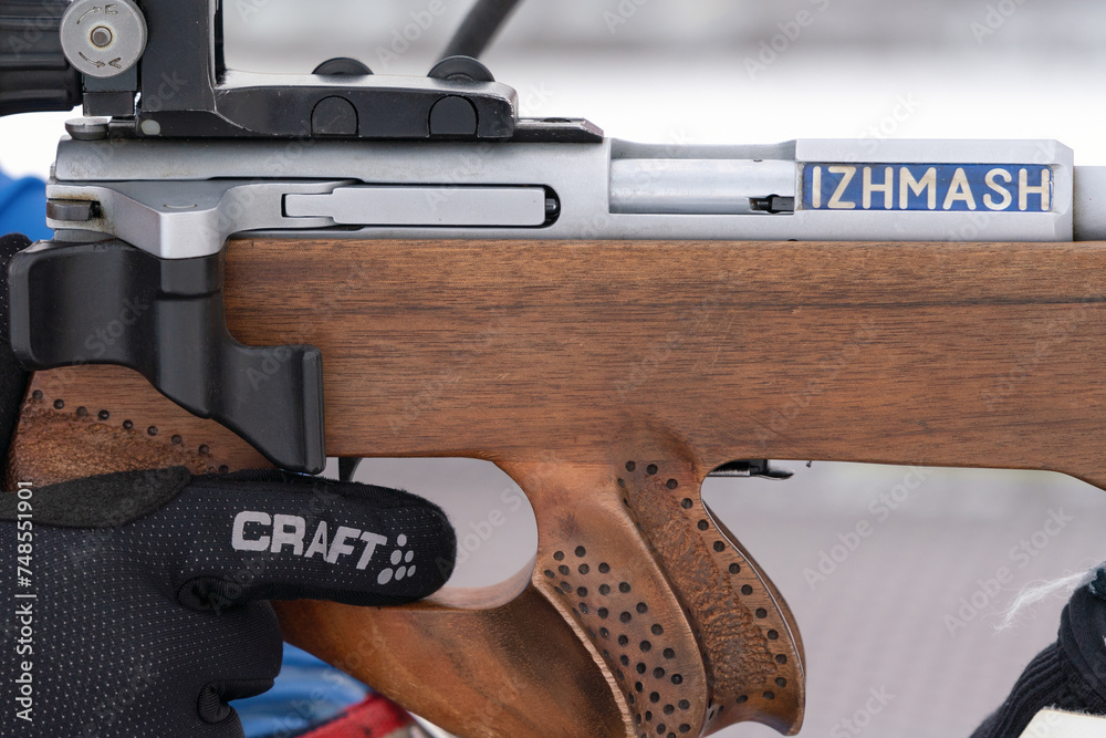 Sportsman biathlete aims rifle shooting. Selective focus, extreme close ...