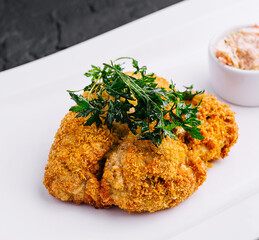 Wall Mural - Chicken schnitzel with sauce on plate