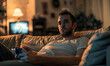 photo concentrated man on couch playing