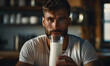 photo front view handsome male drinking milk