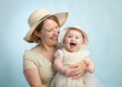 © titima157 - Portrait of handsome mother and cute newborn laughing happy baby