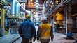 © EnelEva - two men walking in an industrial factory on a sunny day