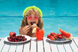Healthy food. Outdoor leisure activity with kids by swimming pool. Summertime. Summer cocktail and fruits. Happy child having fun at swimming pool on summer day. Kids summer holidays and vacation.