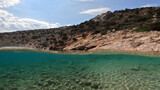 Fototapeta Most - Underwater split photo of paradise fjord rocky bay of Tourkopigado, Iraklia island, small Cyclades, Greece