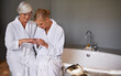 © MV/peopleimages.com - Mother, spa and manicure with daughter, bath and senior woman for bonding and relaxation. Parent, robe and nail polish with cosmetics, guidance and support with beauty treatment or pamper and glasses
