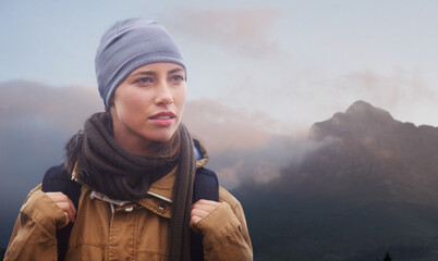 Canvas Print - Woman, hiking and calm in nature with backpack, winter and thinking of exercise in mountain. Person, adventure or trekking gear for safety in outdoor environment, cold or sport or walking for fitness