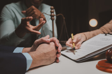 Wall Mural - A group of lawyers is discussing contract documents that must be presented to a client, Lawyers brainstorm to revise important documents that must be submitted to the Supreme Court.