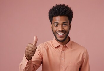 Canvas Print - A friendly man with an afro hairstyle in a peach shirt giving a thumbs up. His radiant smile and casual style are welcoming.