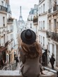 Woman sightseer admiring urban scenery in Paris, France.