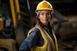 © Firn - Female construction worker with yellow safety vest and helmet