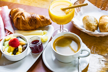 Wall Mural - Breakfast served with coffee, orange juice and croissants