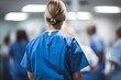 Back view of nurse or doctor in blue garment in hospital