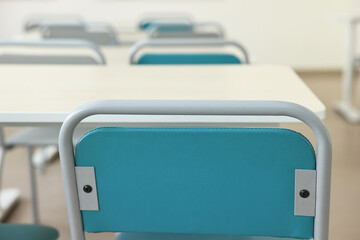 Wall Mural - Empty school classroom with desks and chairs