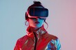 Woman wearing VR goggles in red jacket, looking at the viewer.