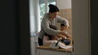 © Marco - Candid mother cooking with children standing in kitchen. Siblings, little boy and sister preparing food with mom in genuine authentic domestic lifestyle scene