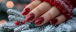 Christmas nail design. Close-up nails in a red hat of Santa. Banner of a manicure sale salon with red extensions. Beautiful woman's hand with red extensions.