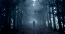 Man walking on foggy road 4k slow motion video