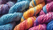 Colorful skeins of yarn for knitting as background, closeup