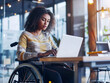 A person with a motor disability working in an inclusive workplace