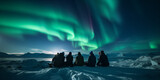 A group of tourist are watching the northern light aurora borealis at a northern light guided tour	
