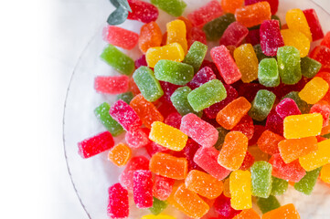 Sweets of all colors on a plate on a table at a children's birthday celebration party