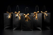 Multiple black shopping and gift bags on background