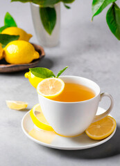 Wall Mural - cup of tea and lemon on the table. Selective focus.