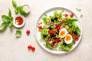 Poster - Soft-boiled egg Easter fresh vegetable salad with tomatoes, chickpea, olives, onion and green lettuce. Healthy food,  breakfast. Top view