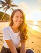 © ffolas - Portrait of happy smiling girl, sitting on ocean beach, at sunset