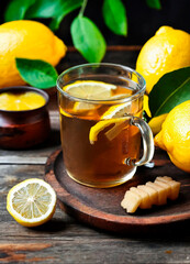 Wall Mural - cup of tea with ginger and lemon. Selective focus.