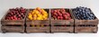 a group of fruit in wooden crates