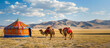 Picturesque rural landscape of Central Asia, with camels and tents typical of the region.